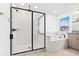 Modern bathroom with a glass-enclosed shower and separate soaking tub at 33263 Sycamore Leaf Dr, Wesley Chapel, FL 33545
