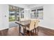 Dining area with modern table, chairs, and sliding glass doors to the patio at 33263 Sycamore Leaf Dr, Wesley Chapel, FL 33545