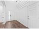 Bright foyer with hardwood floors, featuring a welcoming entrance and a convenient coat closet at 33263 Sycamore Leaf Dr, Wesley Chapel, FL 33545