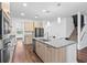 Modern kitchen features stainless steel appliances, granite countertops, and a spacious island at 33263 Sycamore Leaf Dr, Wesley Chapel, FL 33545