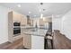 Modern kitchen features stainless steel appliances, granite countertops, and a spacious island with bar seating at 33263 Sycamore Leaf Dr, Wesley Chapel, FL 33545