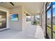 Covered patio with wall mounted flat screen TV offers outdoor living space at 33263 Sycamore Leaf Dr, Wesley Chapel, FL 33545