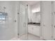 This modern bathroom features a glass shower, white vanity, and stylish fixtures at 34516 Heavenly Ln, Dade City, FL 33525