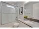 Modern bathroom featuring a glass-enclosed shower, white vanity, and contemporary fixtures at 34516 Heavenly Ln, Dade City, FL 33525