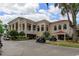 Exterior view of the Lake Jovita Golf & Country Club, showcasing its classic architecture and well-maintained grounds at 34516 Heavenly Ln, Dade City, FL 33525