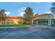 Stunning community clubhouse with a covered entrance and beautiful landscaping at 34516 Heavenly Ln, Dade City, FL 33525