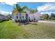Inviting home with a lush lawn, a two-car garage, and tasteful landscaping at 34516 Heavenly Ln, Dade City, FL 33525