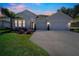 Charming home with a well-manicured lawn, a two-car garage, and tasteful landscaping at 34516 Heavenly Ln, Dade City, FL 33525