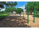Enjoy a playground complete with swings and slides surrounded by mature trees and a grassy area at 34516 Heavenly Ln, Dade City, FL 33525