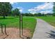 Take a stroll on the community's paved walking path surrounded by lush green space and mature trees at 34516 Heavenly Ln, Dade City, FL 33525