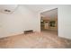 Neutral bonus room provides flexible space with carpet floors, offering a view to the backyard at 34527 Cedarfield Dr, Dade City, FL 33523