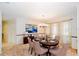 Formal dining room with elegant decor, a chandelier, and bright natural light at 34527 Cedarfield Dr, Dade City, FL 33523