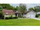 Charming single-Gathering home with a brick accent wall, well-manicured lawn, and inviting curb appeal at 34527 Cedarfield Dr, Dade City, FL 33523