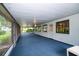 Spacious screened porch with ceiling fans and views of the surrounding greenery at 34527 Cedarfield Dr, Dade City, FL 33523