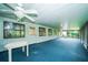 Large screened porch with multiple windows offering tranquil outdoor views at 34527 Cedarfield Dr, Dade City, FL 33523