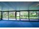 Inviting sunroom with comfortable seating overlooking the lush backyard at 34527 Cedarfield Dr, Dade City, FL 33523