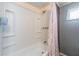 Cozy bathroom featuring a shower and tub combination at 37025 Lois Ave, Zephyrhills, FL 33542