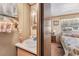 Bathroom vanity and sink that open up into the bedroom at 37025 Lois Ave, Zephyrhills, FL 33542