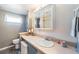 Neutral bathroom with vanity, sink, and toilet has plenty of counter space at 37025 Lois Ave, Zephyrhills, FL 33542