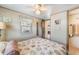 Bedroom with closet, ceiling fan, and natural light at 37025 Lois Ave, Zephyrhills, FL 33542
