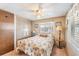 Bedroom with ceiling fan, closet and neutral tones at 37025 Lois Ave, Zephyrhills, FL 33542