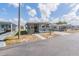 Charming single-story home featuring a covered parking area and a well-maintained yard at 37025 Lois Ave, Zephyrhills, FL 33542
