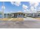 Charming single-story home featuring a covered parking area and a well-maintained yard at 37025 Lois Ave, Zephyrhills, FL 33542