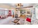 Open concept living room with easy access to kitchen and sun room provides versatile living space at 37025 Lois Ave, Zephyrhills, FL 33542