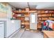 Utility room with washer, dryer, shelving and storage at 37025 Lois Ave, Zephyrhills, FL 33542