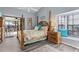 Serene bedroom with sliding door to covered patio with outdoor seating at 3819 Barnegat Dr, Punta Gorda, FL 33950
