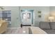 Inviting entryway featuring double doors with decorative glass, neutral tones, and tiled flooring at 3819 Barnegat Dr, Punta Gorda, FL 33950