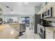 Bright open kitchen with modern appliances and sliding door access to backyard at 3819 Barnegat Dr, Punta Gorda, FL 33950