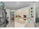 Bright kitchen features stainless steel appliances, white cabinets, and modern countertops at 3819 Barnegat Dr, Punta Gorda, FL 33950