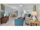 Spacious living area with tile floors, neutral decor, and an open layout to the dining room at 3819 Barnegat Dr, Punta Gorda, FL 33950