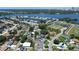 Beautiful aerial view of the surrounding area including green spaces and a shimmering body of water at 3841 Wahoo Se Dr, St Petersburg, FL 33705