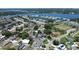 An aerial view reveals the home's proximity to a scenic lake and recreational facilities at 3841 Wahoo Se Dr, St Petersburg, FL 33705