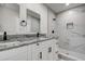Modern bathroom with double vanity, updated shower and black matte hardware at 3841 Wahoo Se Dr, St Petersburg, FL 33705