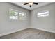 Bright bedroom filled with natural light from the windows at 3841 Wahoo Se Dr, St Petersburg, FL 33705