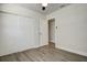 Bedroom with ceiling fan, vinyl flooring and a closet at 3841 Wahoo Se Dr, St Petersburg, FL 33705