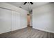 Bedroom with ceiling fan, vinyl flooring and large closet at 3841 Wahoo Se Dr, St Petersburg, FL 33705