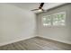 Bedroom with ceiling fan and natural light from the double windows at 3841 Wahoo Se Dr, St Petersburg, FL 33705