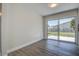 Bright dining area with large sliding glass door and vinyl flooring at 3841 Wahoo Se Dr, St Petersburg, FL 33705