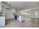 Modern kitchen with granite countertops, stainless steel oven and island with bright white cabinets and vinyl flooring at 3841 Wahoo Se Dr, St Petersburg, FL 33705