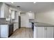 Bright, updated kitchen with stainless steel appliances, granite countertops, and white cabinets at 3841 Wahoo Se Dr, St Petersburg, FL 33705