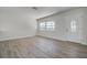 Bright living room featuring stylish flooring, a window and a glass front door at 3841 Wahoo Se Dr, St Petersburg, FL 33705