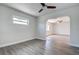 Open-concept living space with vinyl flooring and large window at 3841 Wahoo Se Dr, St Petersburg, FL 33705