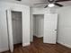 Bedroom features closet with open door and a ceiling fan at 3918 E Clifton St, Tampa, FL 33610