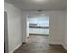 Bright kitchen features white cabinets, granite countertops, and stainless steel sink at 3918 E Clifton St, Tampa, FL 33610