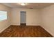 Spacious living room with wood-look flooring and ample natural light at 3918 E Clifton St, Tampa, FL 33610