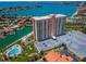 Aerial view of the high rise, waterfront, parking, and pool at 4900 Brittany S Dr # 502, St Petersburg, FL 33715